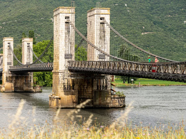 Cyclists cross the Rhône river 